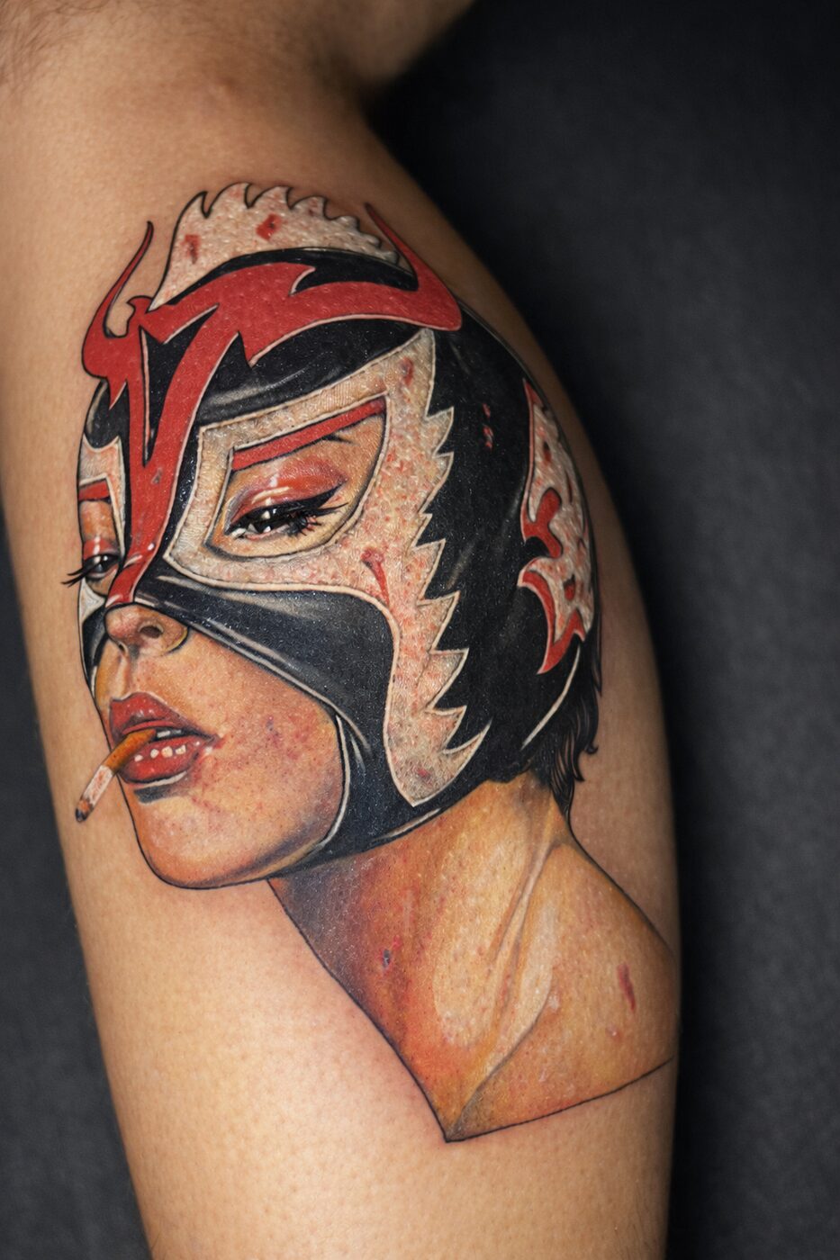 Color realism tattoo of a woman in a luchador mask by Jeremy Swan