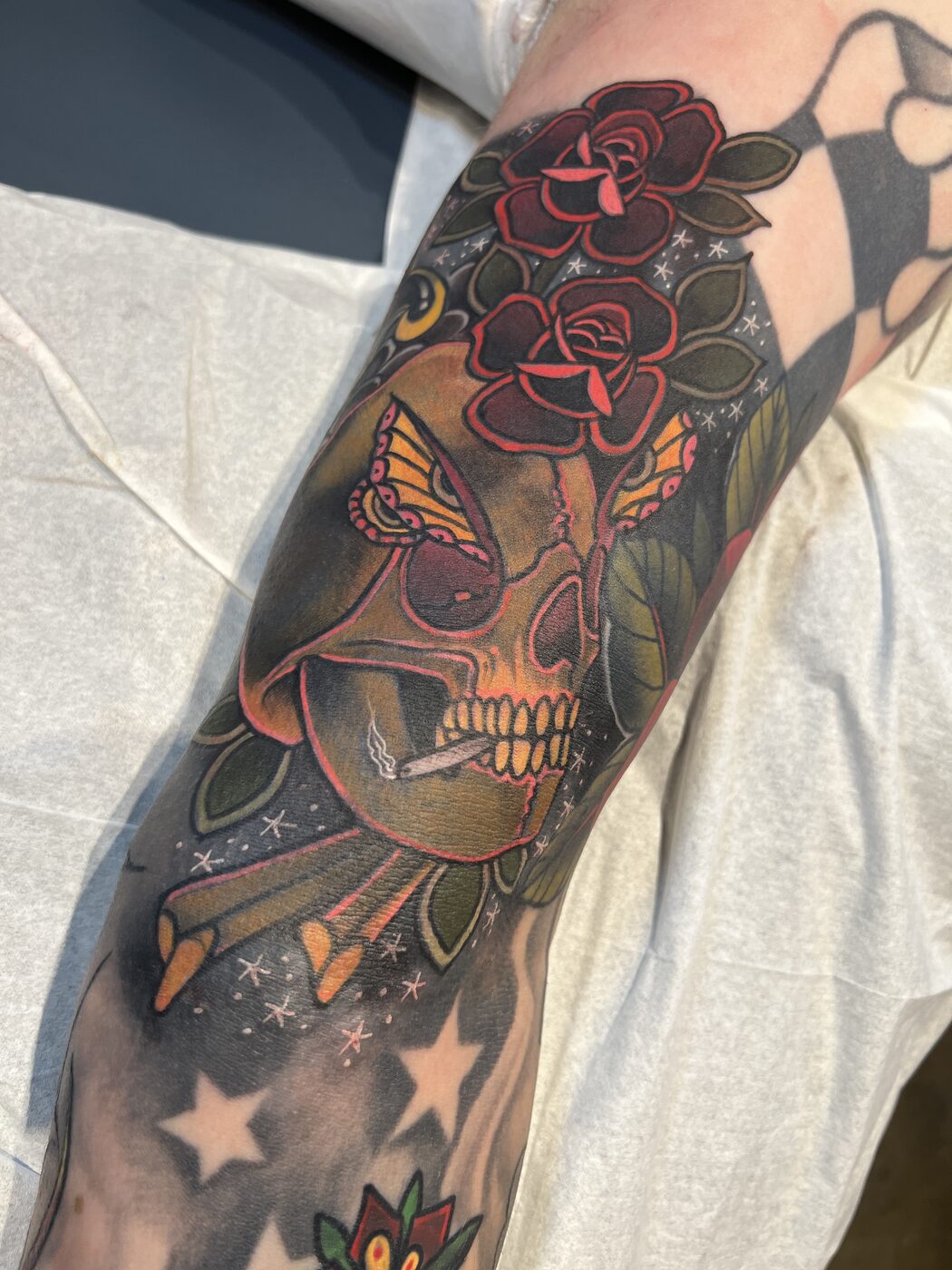Traditional skull, butterfly and roses cover-up tattoo by Broken Art Tattoo, Los Angeles