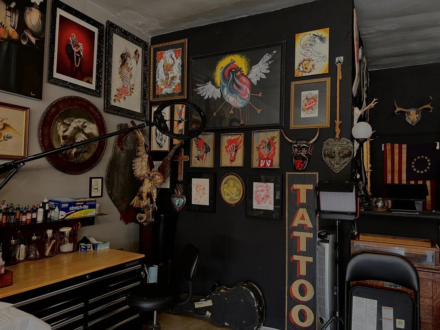 Art-covered walls inside the studio